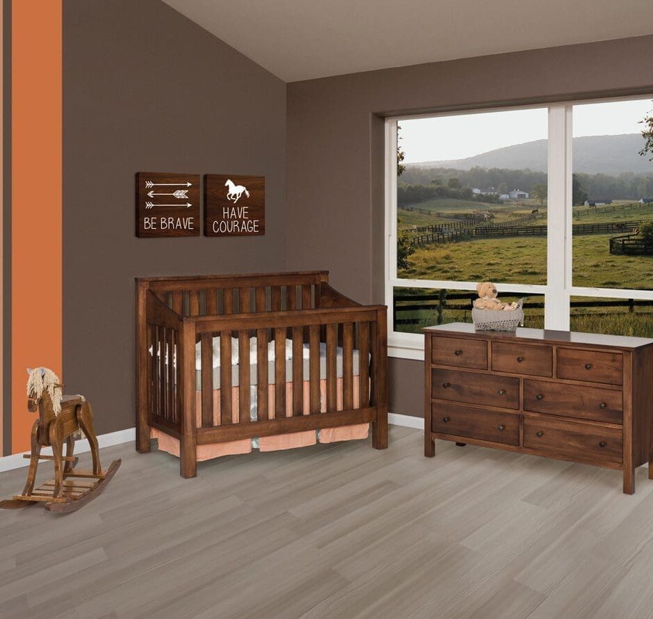 mission nursery setting with slat crib, dresser, and rocking horse