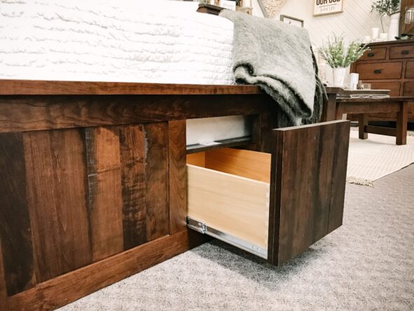 Close up of an underbed storage drawer pulled out.
