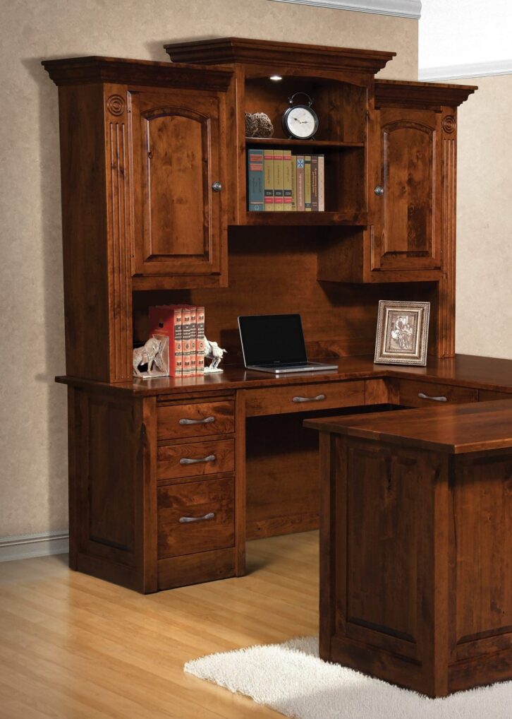 Large Victorian desk made from brown hardwood with cabinets, drawers, open shelves, and an L-shaped desk.