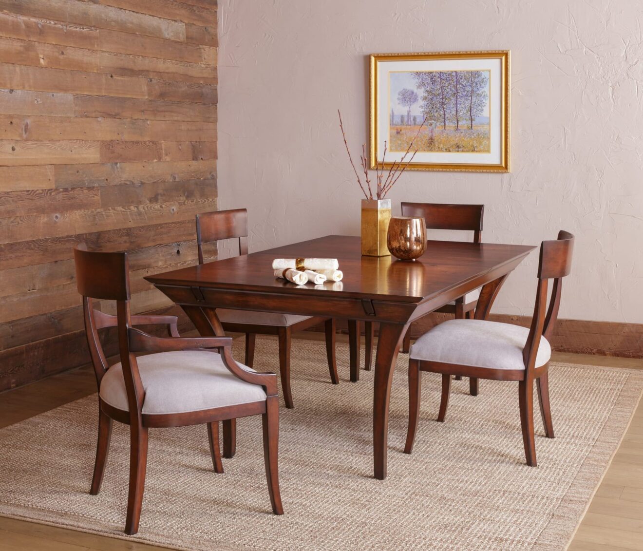 Hardwood dining set with a rectangle table that has curved legs and hardwood dining chairs with white padded seats.