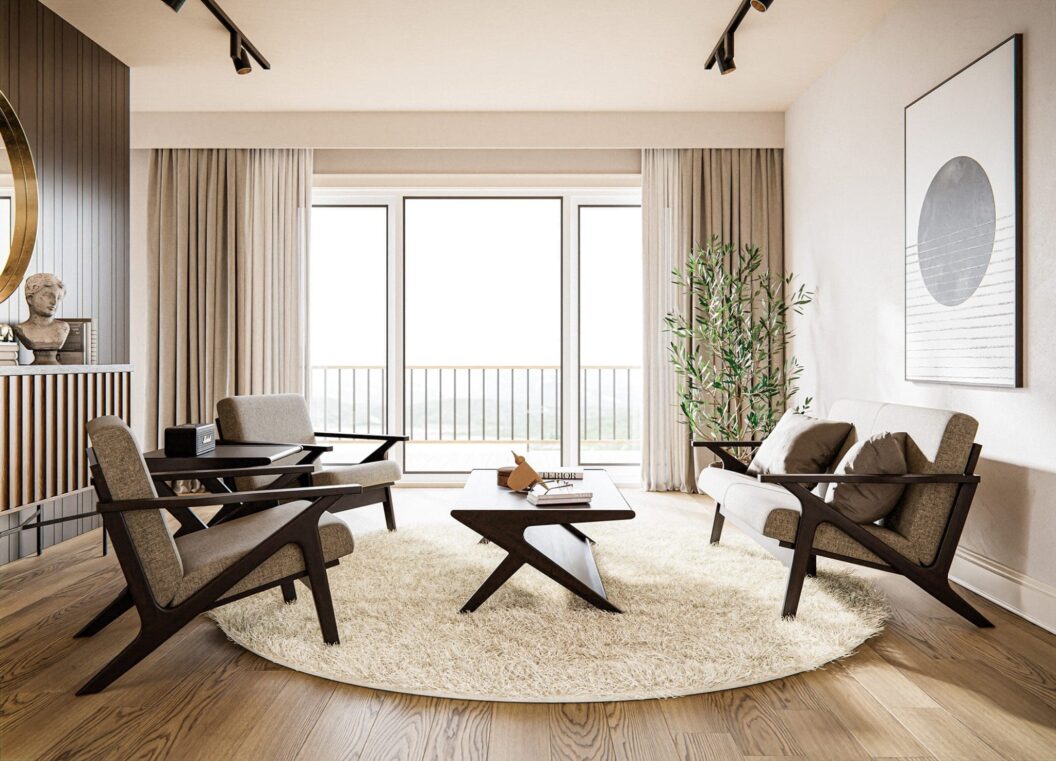 Living room with white walls, a large white round rug in the middle of the room, a fabric and hardwood loveseat with gray pillows, 2 matching fabric and hardwood arm chairs, a hardwood end table, and a hardwood coffee table.